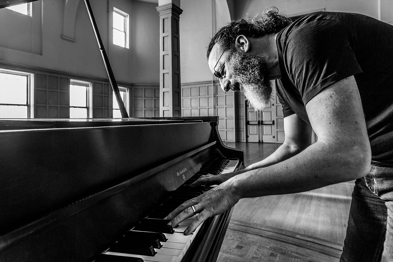 Matthew Bennett playing piano.