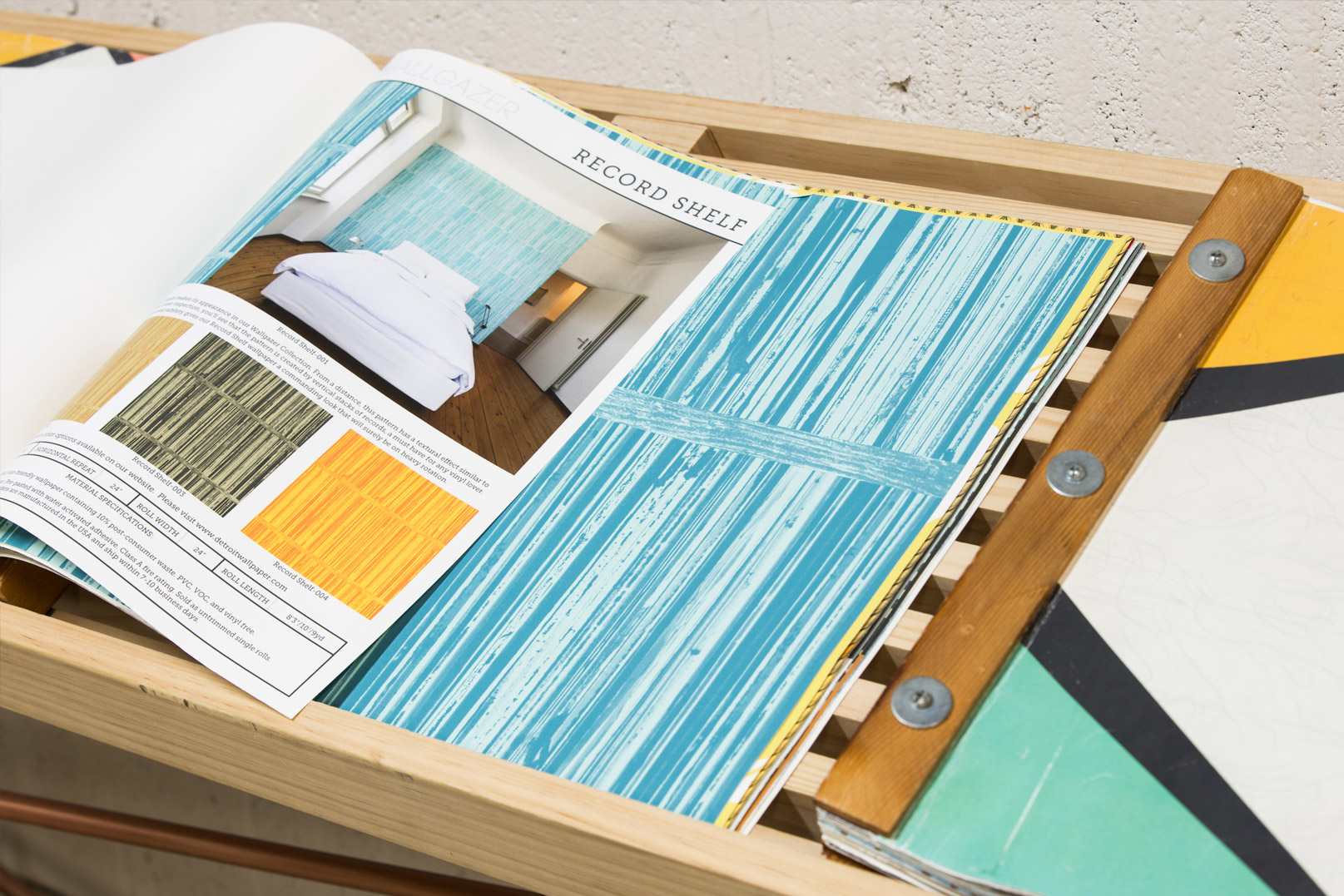 Close-up image of a book of wallpaper designs.