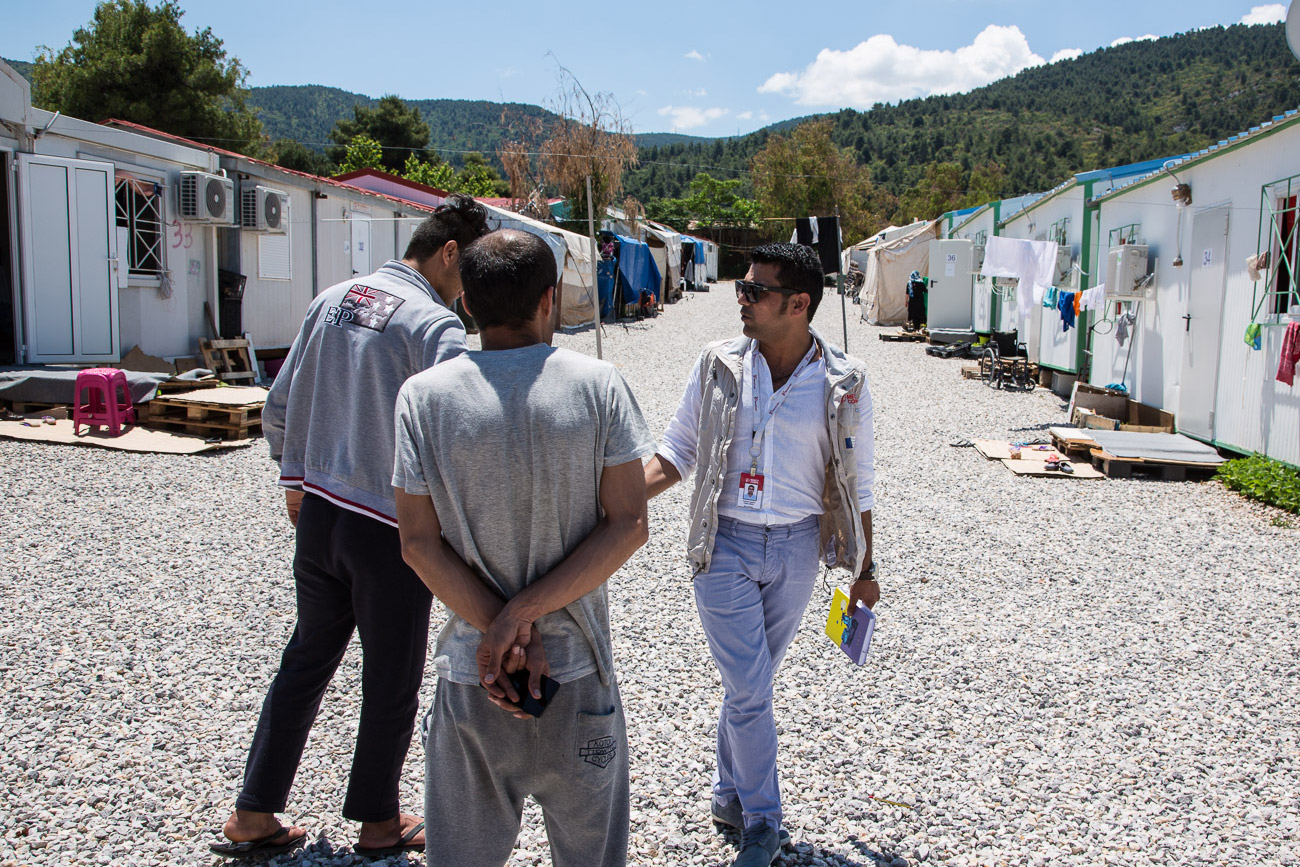 Farhad Agajani meets with refugees and asks how he can help. 