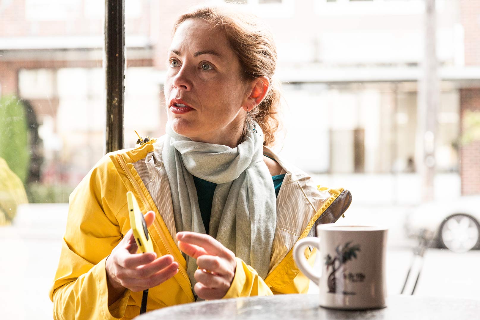 Laura with her windows phone and a coffee