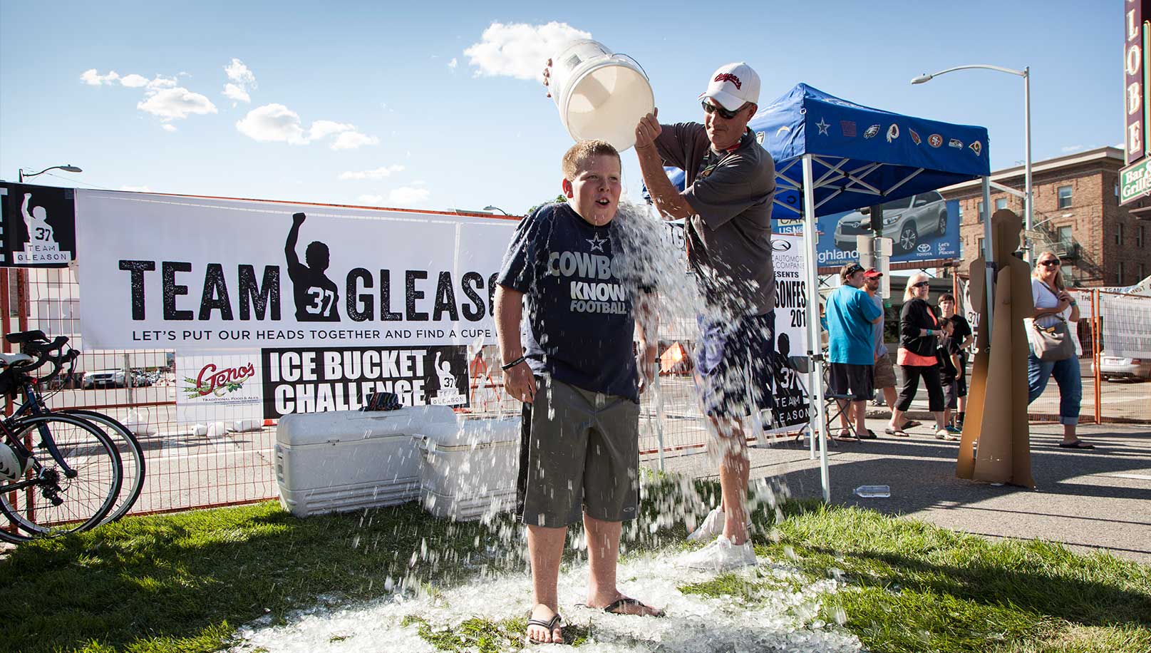 A kid doing the icebucket challenge at Gleason Fest