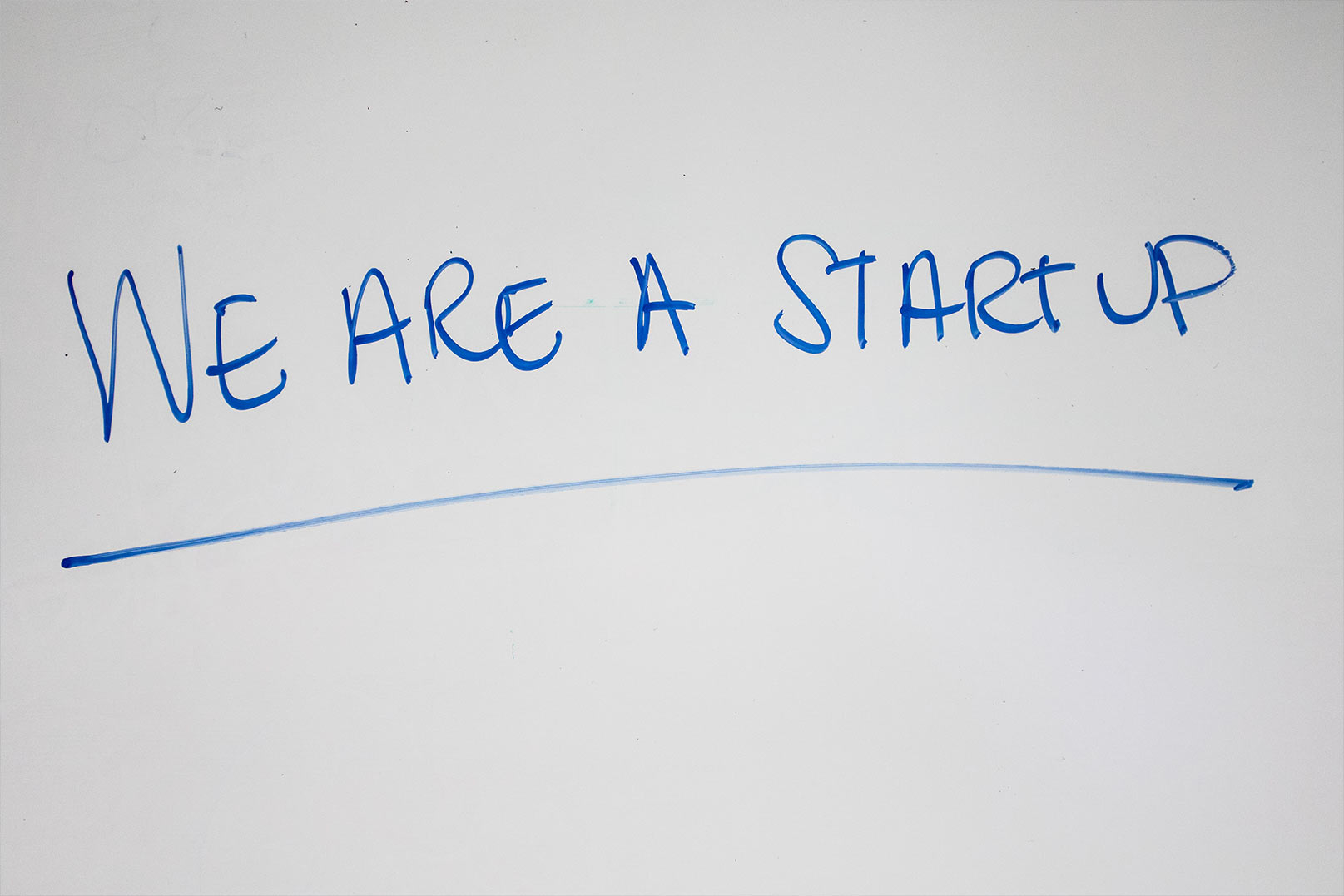 A white board with we are a startup written on it