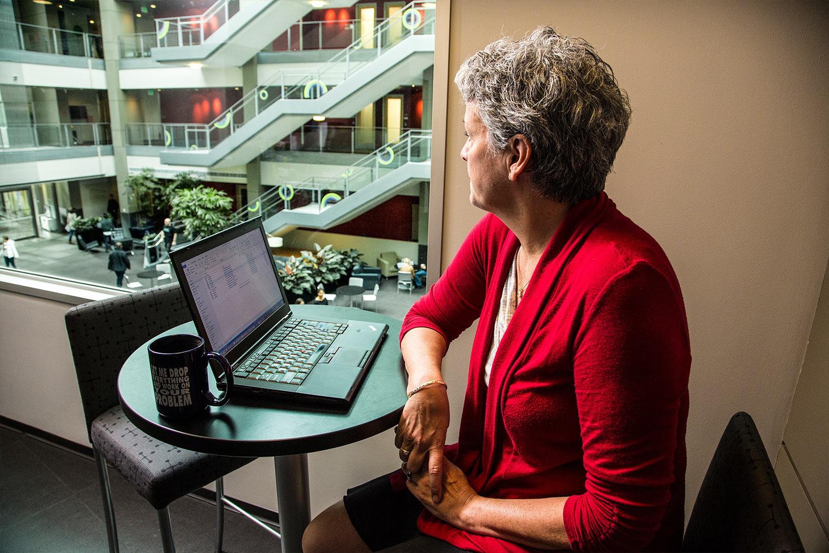Nancy with her laptop and some coffee