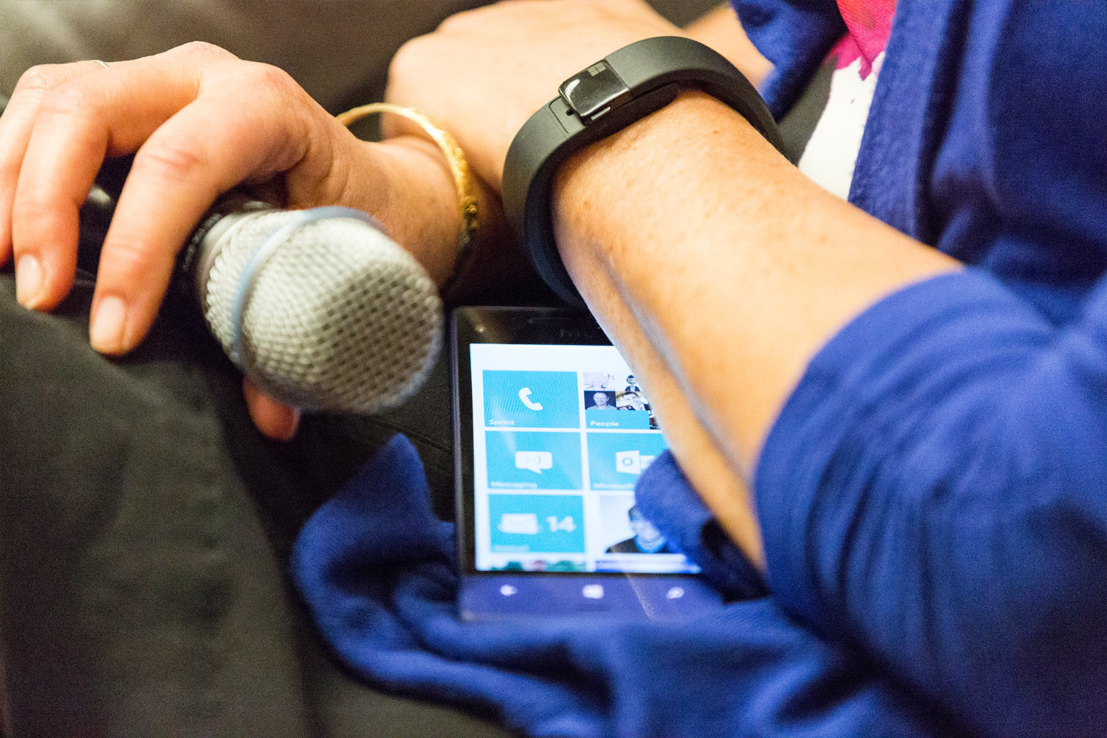 Nancy with a microphone and Microsoft devices