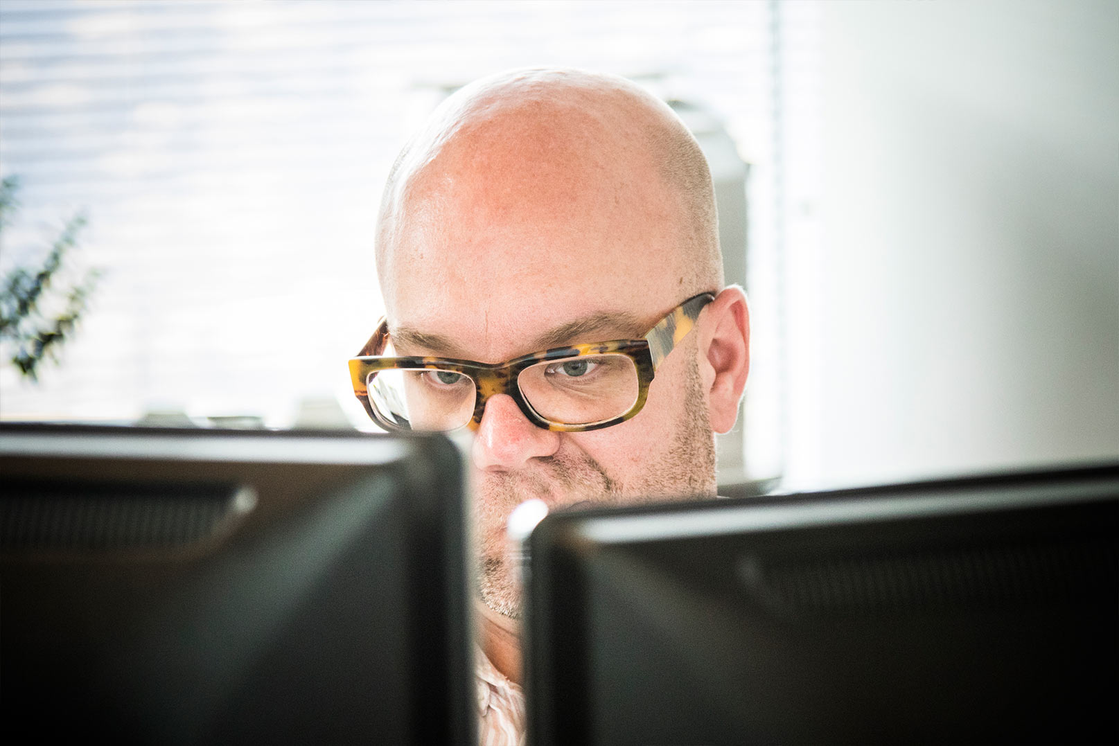 Scott behind his monitors